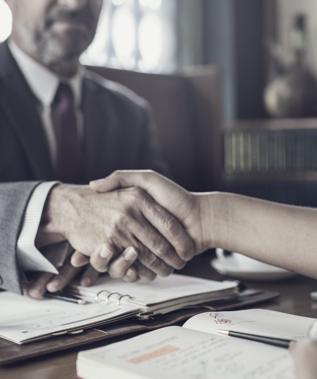 Attorney David E. Grande meeting with a client